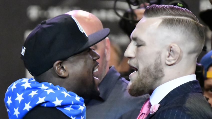 Floyd Mayweather Jr. (L) faces off for the first time with UFC fighter Conor McGregor during a press call at the Staples Center in  Los Angeles, California on July 11, 2017.
The two will fight August 26th in Las Vegas, Nevada. / AFP PHOTO / Gene Blevins        (Photo credit should read GENE BLEVINS/AFP/Getty Images)