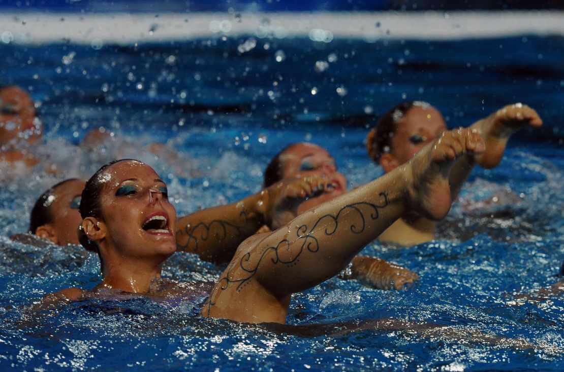 Members of the Hungarian synchronized swimming team perform during halftime of the Water Polo European Championships match between Hungary and Spain.