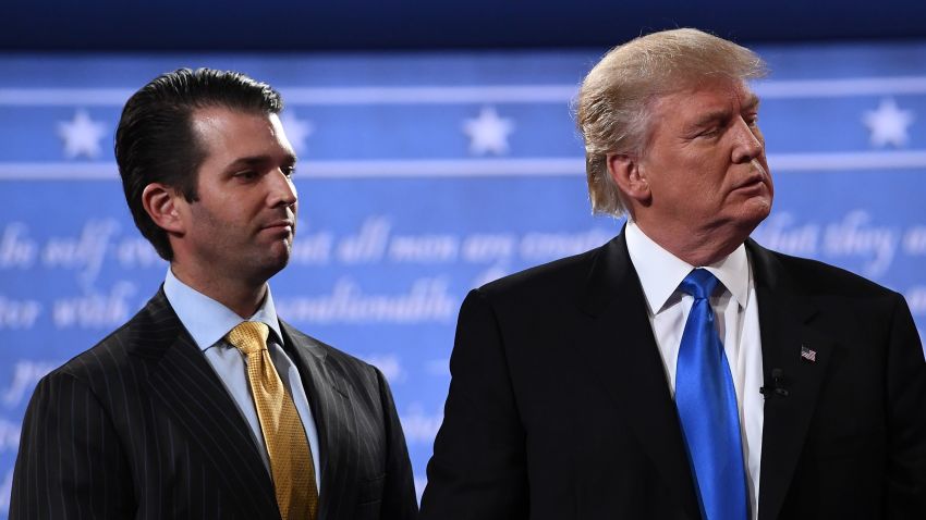 Republican nominee Donald Trump (R) stands with his son  Donald Trump Jr. after the first presidential debate at Hofstra University in Hempstead, New York on September 26, 2016. / AFP / Jewel SAMAD        (Photo credit should read JEWEL SAMAD/AFP/Getty Images)
