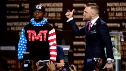 LOS ANGELES, CA - JULY 11:  Floyd Mayweather Jr. and Conor McGregor faceoff on stage during the Floyd Mayweather Jr. v Conor McGregor World Press Tour at Staples Center on July 11, 2017 in Los Angeles, California.  (Photo by Harry How/Getty Images)