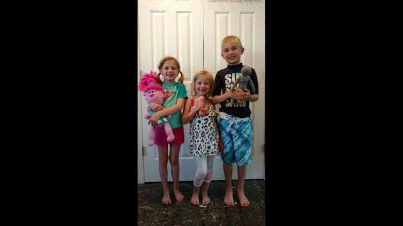 Evelyn Londt (1st grade), Isabella Londt (Kindergarten) and Oliver Londt (3rd grade) hold handmade toys from Ms. Trudy.