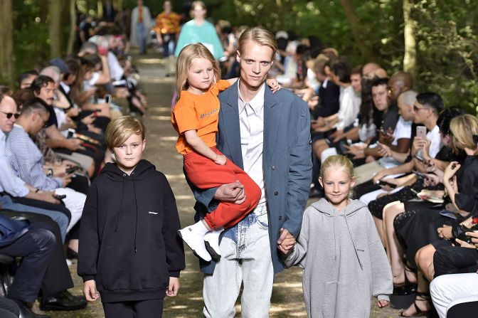 Demna Gvasalia's latest Balenciaga show featured real families clad in hoodies and blazers. 