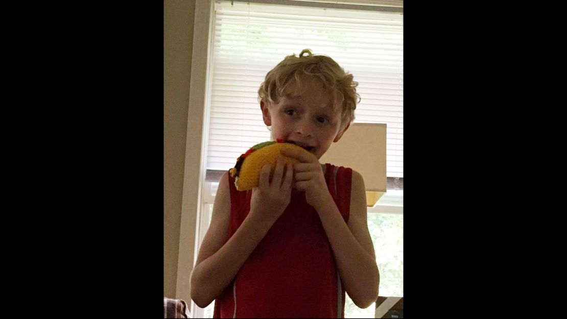 10-year old Vincent Lamon pretends to eat his yarn taco.