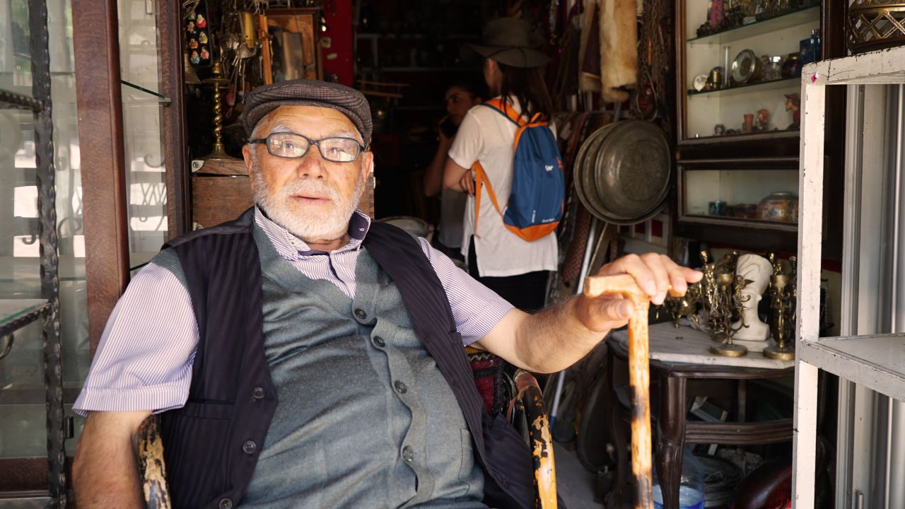 Ismet Sinaktas takes a rest outside an antiques shop in Ankara.