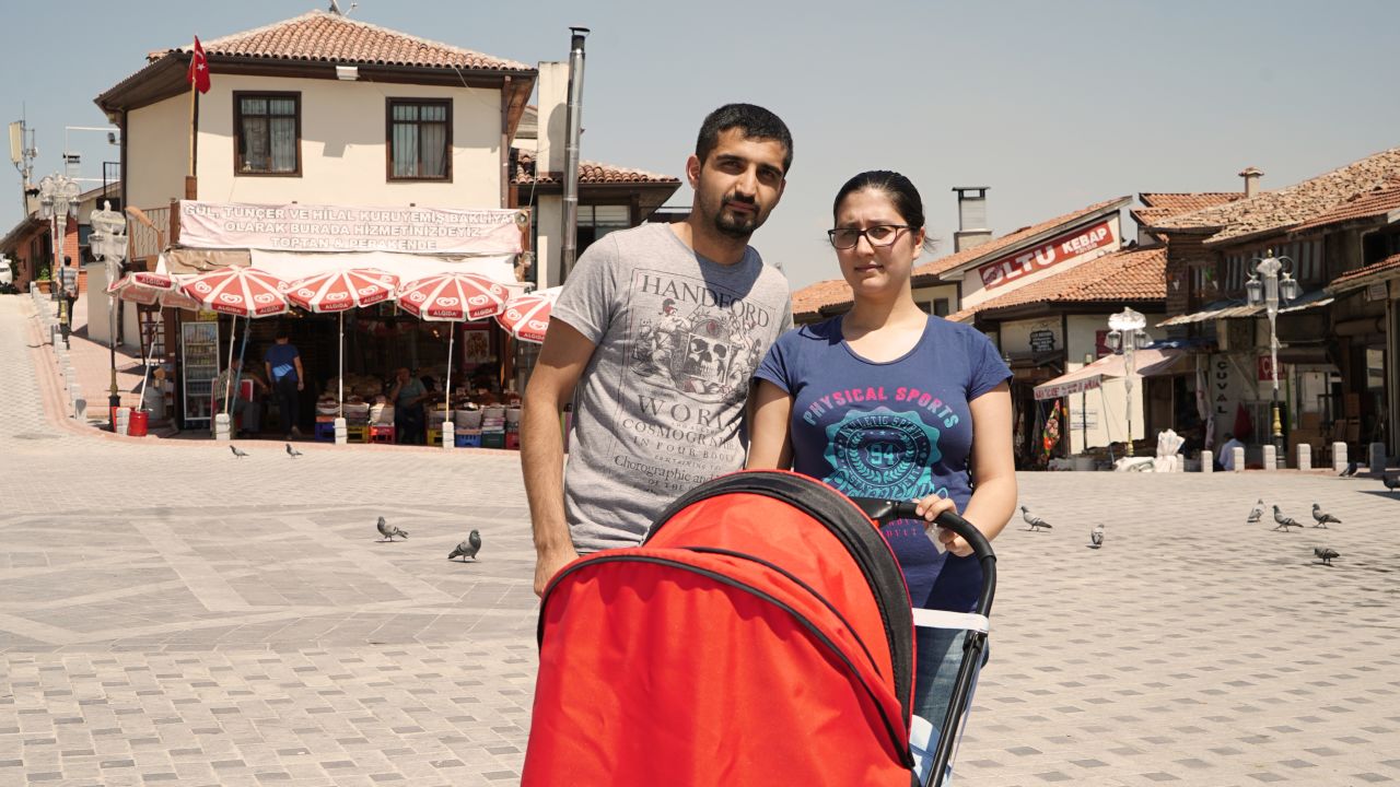 Volkan Guner with his partner Merve, also 27, and their three-month child.