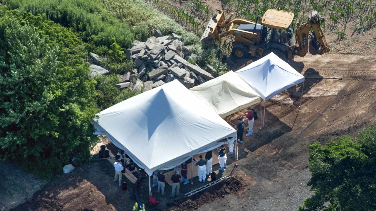 Investigators search Wednesday for clues in the missing men case at a farm in Solebury Township.