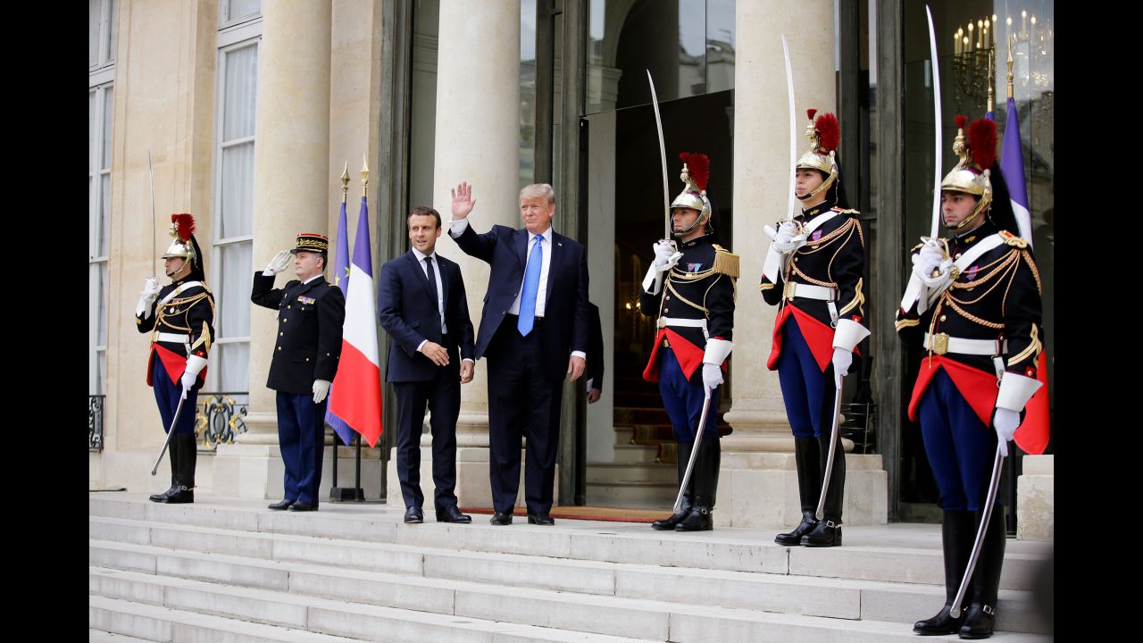 President Macron welcomes Trump before their meeting at the Elysee Palace.