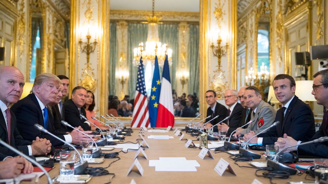 The leaders sit across a table at the Elysee Palace.