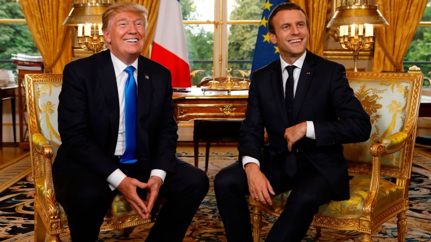 French President Emmanuel Macron (R) and US President Donald Trump (L) smile during their meeting at the Elysee Palace in Paris on July 13, 2017. / AFP PHOTO / POOL / KEVIN LAMARQUE        (Photo credit should read KEVIN LAMARQUE/AFP/Getty Images)