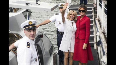 The first ladies leave a boat after a trip on the Seine River on July 13.