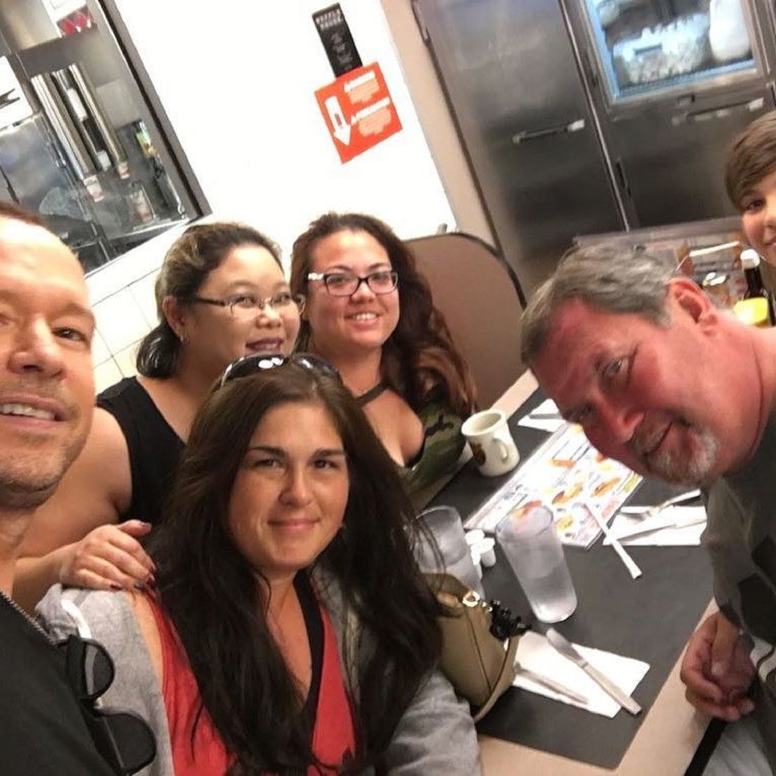 Donnie Wahlberg poses for a selfie with some fans.