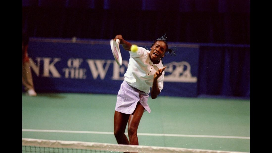 Venus hits an overhead during her first pro tournament in 1994.