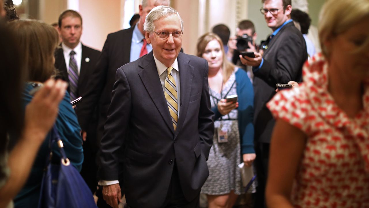 WASHINGTON, DC - JULY 13: Senate Majority Leader Mitch McConnell (R-KY) smiles as he heads for the Senate Floor following a meeting where he shared a new version of a healthcare bill with fellow GOP senators at the U.S. Capitol July 13, 2017 in Washington, DC. The latest version of the proposed bill aims to repeal and replace the Affordable Care Act, also knows as Obamacare. (Photo by Chip Somodevilla/Getty Images)