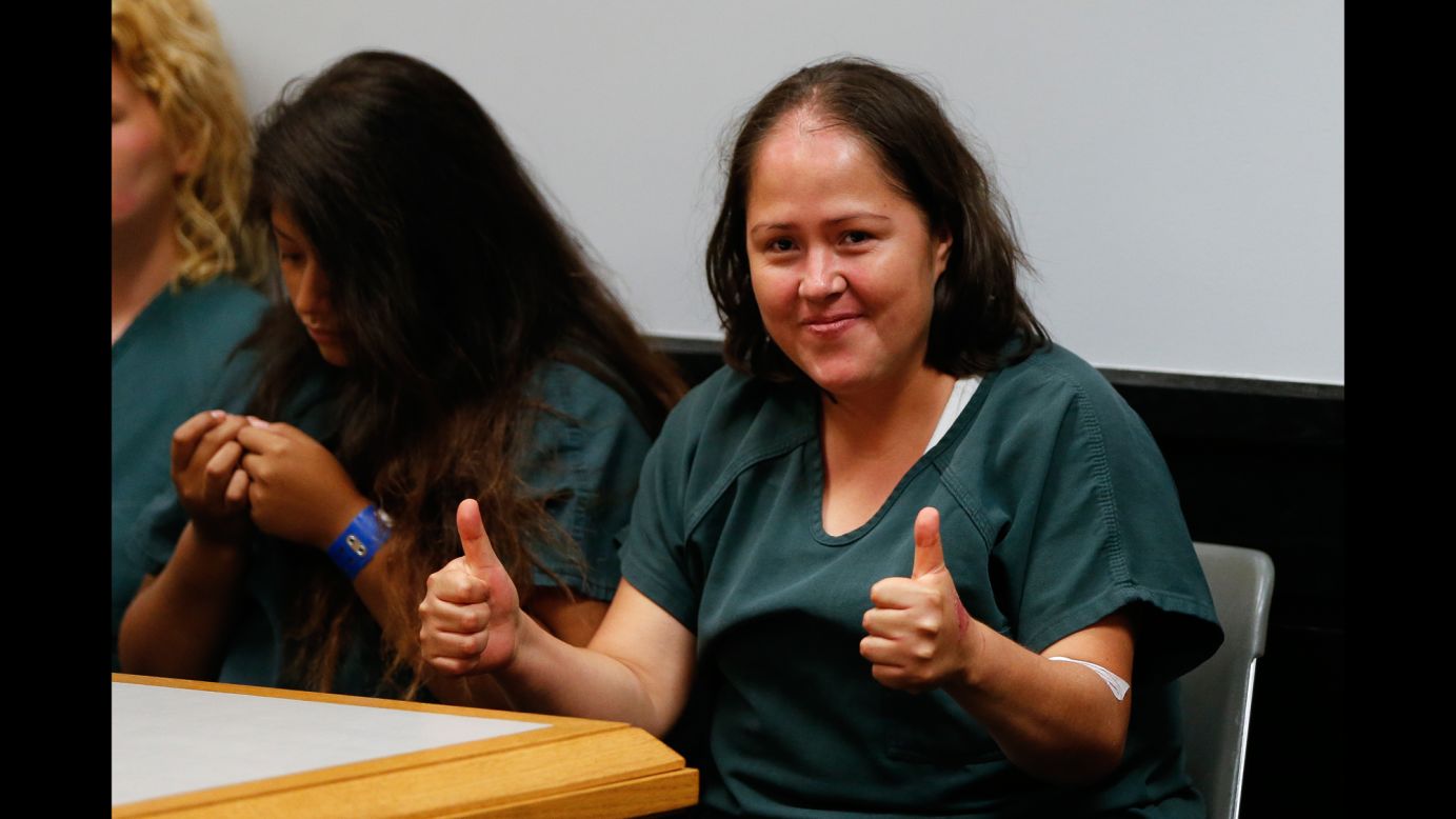 Isabel Martinez, a Georgia woman accused of fatally stabbing four of her children and their father, gives a thumbs-up to cameras during <a href="http://www.cnn.com/2017/07/07/us/georgia-stabbing-court-thumbs-up/index.html" target="_blank">her first court appearance</a> on Friday, July 7. She faces five counts of murder, five counts of malice murder and six counts of aggravated assault.