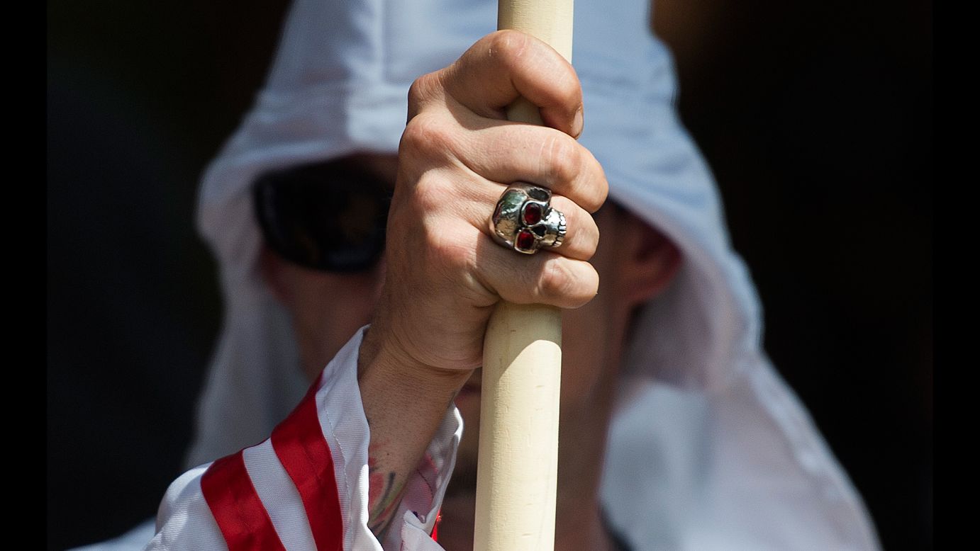 A member of the Ku Klux Klan participates in a rally in Charlottesville, Virginia, on Saturday, July 8. About 50 Klan members and supporters <a href="http://www.cnn.com/2017/07/08/us/kkk-rally-charlottesville-statues/index.html" target="_blank">were protesting the city's plan</a> to remove a statue of Confederate Gen. Robert E. Lee from a park -- one of several steps the city is taking to reduce its number of Confederate monuments. Several hundred counterprotesters also showed up.