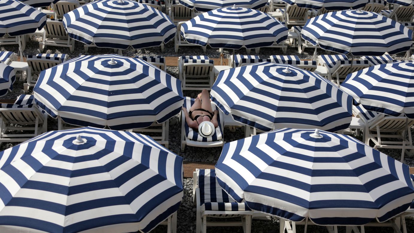 A woman enjoys a beach in Nice, France, on Tuesday, July 11.