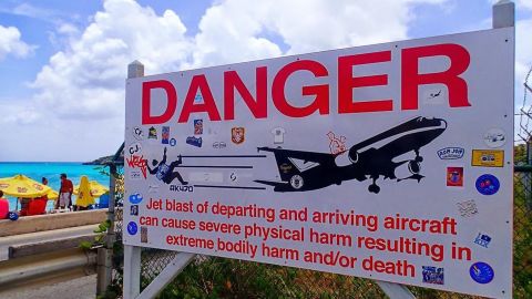 A sign near St. Maarten's Princess Juliana International Airport warns people about the danger from airplane jet engines.