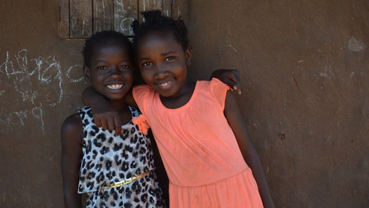 Mata, left, and Violah met up in the village after their return. "The only trauma this poor kid ever experienced," says Mata's adoptive father, Adam Davis, "was because we essentially placed an order for a child."