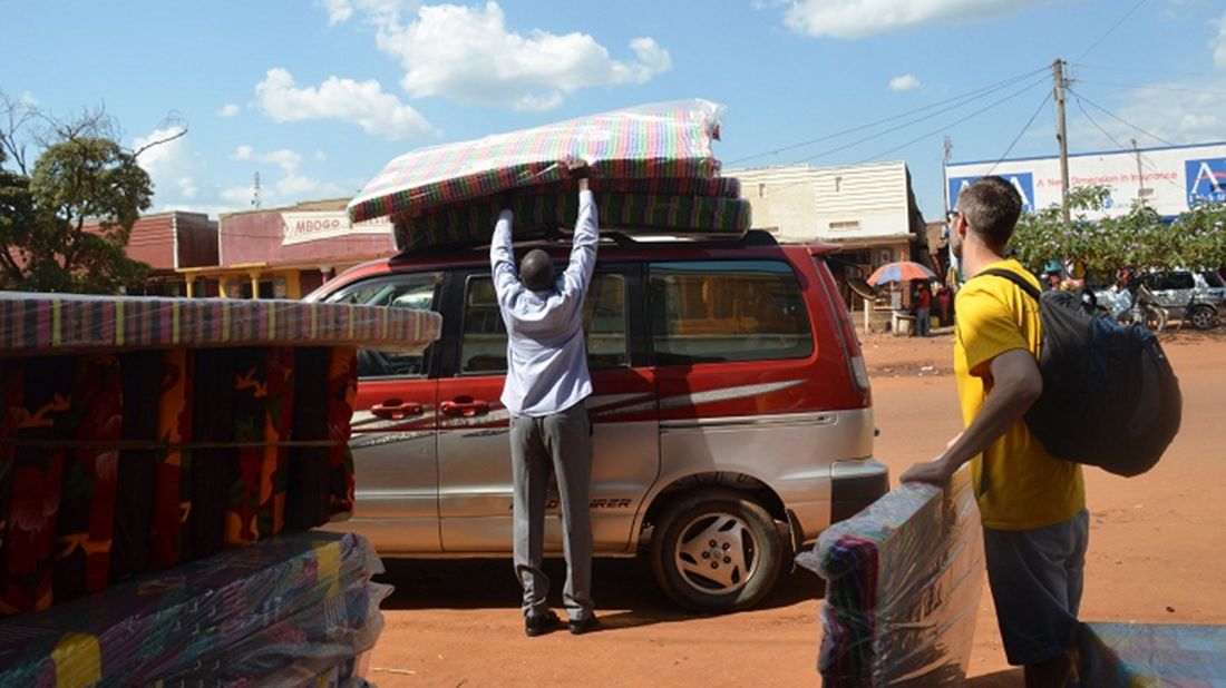 Adam Davis, right, accompanied Namata on her return journey to Uganda while his wife, Jessica, stayed home with their children. "If our child had been taken from us," he said, "we would want our child back."<br />