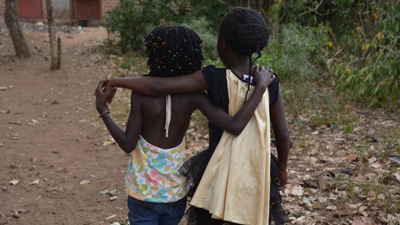 Mata, left, and Violah were taken from the same village and adopted by two US families. After they were returned to their mothers, the girls became fast friends.