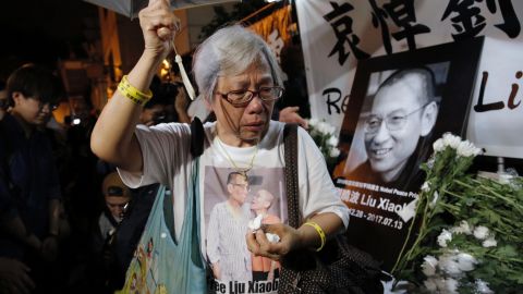 A protester cries as she mourns Liu Xiaobo during a demonstration outside the Chinese liaison office in Hong Kong, Thursday, July 13.