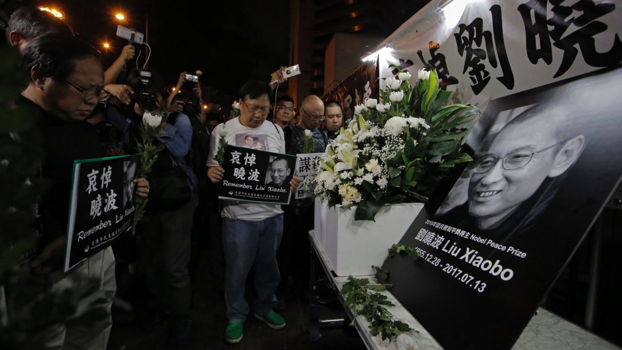 Protesters mourn jailed Chinese Nobel Peace laureate Liu Xiaobo, who died at the age of 61.