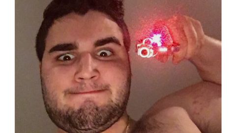 Alleged killer Cosmo Dinardo holds a firearm in an undated photo posted on social media.