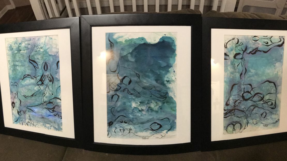 Nadia's paintings were framed and displayed at her high school.