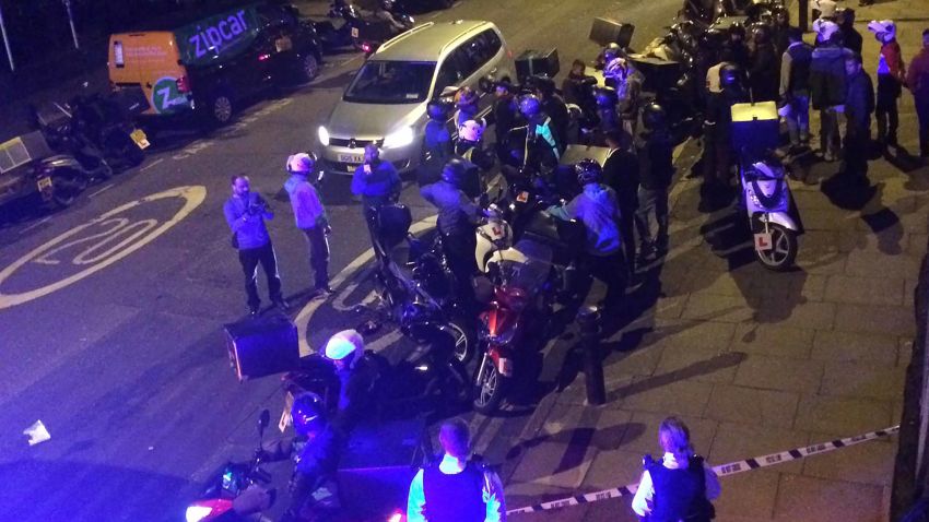 Twitter post captions: Police and ambulances on Hackney/Queensbridge Road, possible acid/petrol attack. Lots of @UberEATS @Deliveroo drivers rallied round
