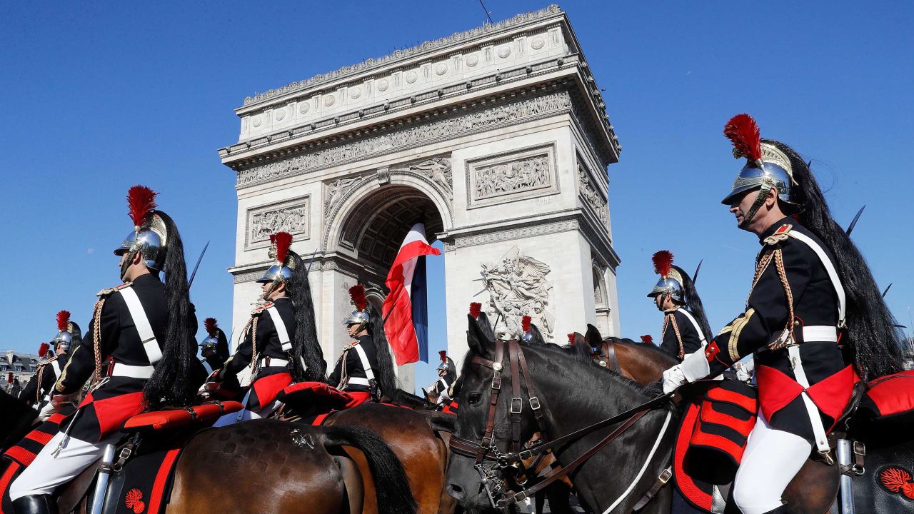French Mounted Republican guards march during the traditional military parade as part of the Bastille Day military parade on the Champs Elysees avenue in Paris on July 14, 2017.