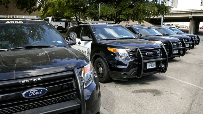 Austin Police Ford utility vehicles are parked on East 8th Street outside APD Headquarters on Tuesday July 11, 2017.