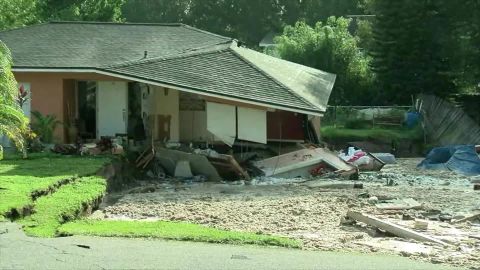 A house starts falling Friday into a sinkhole in Land O' Lakes, Florida.