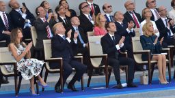 (FromL) US First Lady Melania Trump, US President Donald Trump, French President Emmanuel Macron and his wife Brigitte Macron attend the annual Bastille Day military parade on the Champs-Elysees avenue in Paris on July 14, 2017.Bastille Day, the French National Day, is held annually each July 14, to commemorate the storming of the Bastille fortress in 1789. This years parade on Paris's Champs-Elysees will commemorate the centenary of the US entering WWI and will feature horses, helicopters, planes and troops. / AFP PHOTO / CHRISTOPHE ARCHAMBAULT        (Photo credit should read CHRISTOPHE ARCHAMBAULT/AFP/Getty Images)