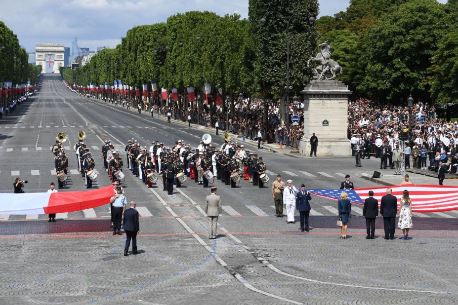 The Trumps join Macron and French first lady Brigitte Macron near the end of the parade on July 14. Bastille Day celebrates the storming of the Bastille military prison in 1789, a key date in the French Revolution. Friday's military display also commemorated the centennial of the US entry into World War I. 