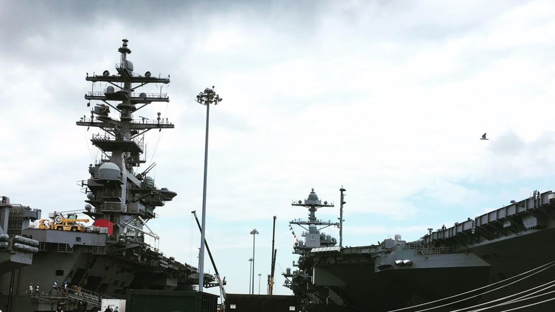 The USS Gerald Ford docked at Naval Station Norfolk next to the USS Dwight D. Eisenhower.