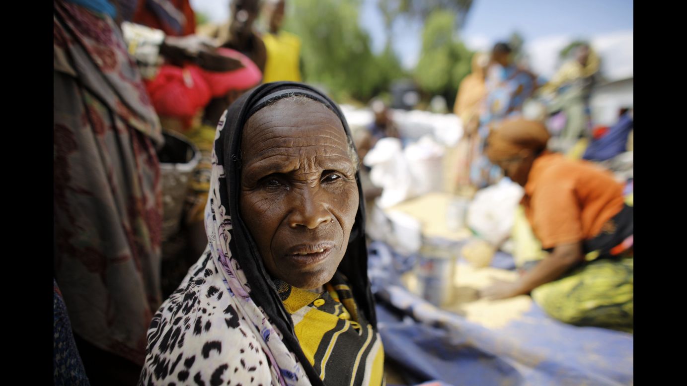 At a CARE distribution center in Ethiopia, 60-year-old Kediya Shekeleh collects her monthly rations of split peas, wheat and oil. "This has been the worst drought I have seen in my lifetime," she says. 