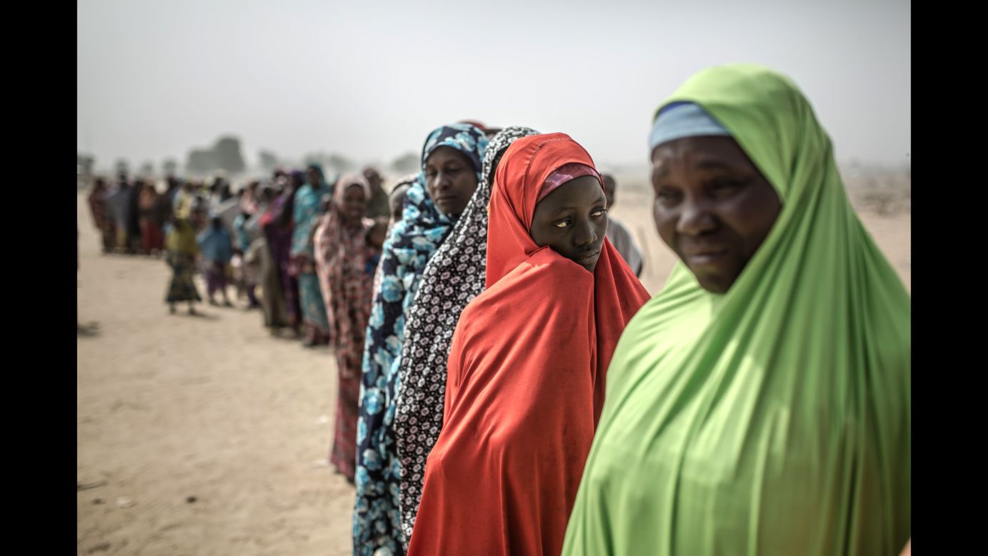 Women gather at the entrance to a camp in northeast Nigeria where more than 30,000 people have sought refuge from the violence of Boko Haram.