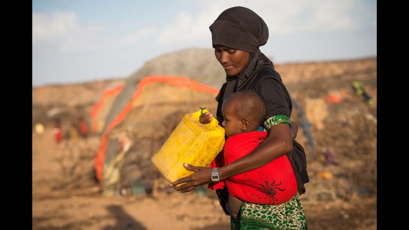 Rhama Ismail shares some water with her 1-year-old daughter in Somalia.  "I just don't know how my daughter will grow up or if she will go to school," she says. "I am worried for her future."