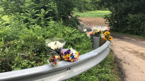 Solebury Township residents leave flowers outside farmland where four young men were killed. 
