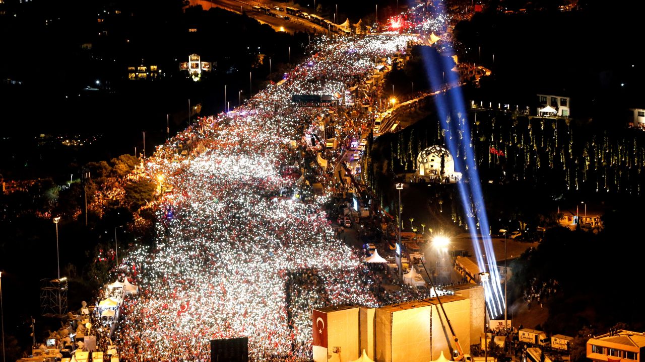 People in Istanbul gather to commemorate the failure of last year's coup.