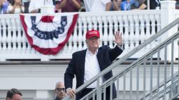 US President Donald Trump waves to well wishers as he arrives at the 72nd US Women's Open Golf Championship at Trump National Golf Course in Bedminster, New Jersey, July 15, 2017. / AFP PHOTO / SAUL LOEB        (Photo credit should read SAUL LOEB/AFP/Getty Images)