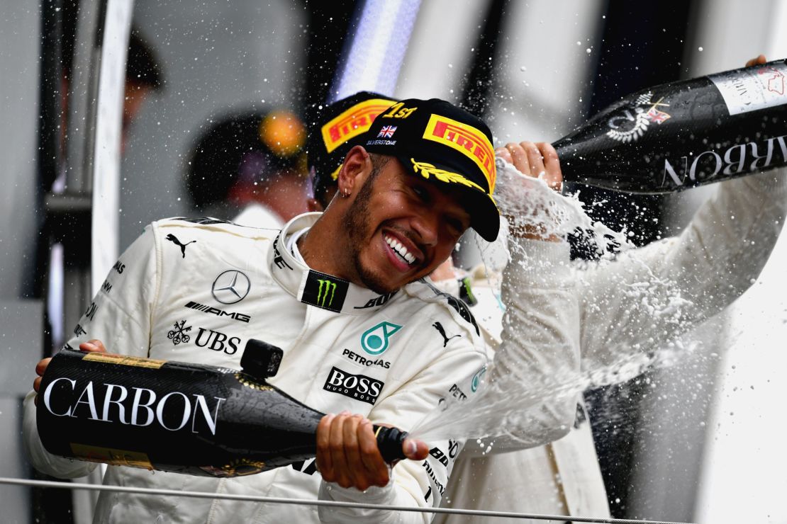 Lewis Hamilton celebrates in traditional style after winning his fourth race of the 2017 season.