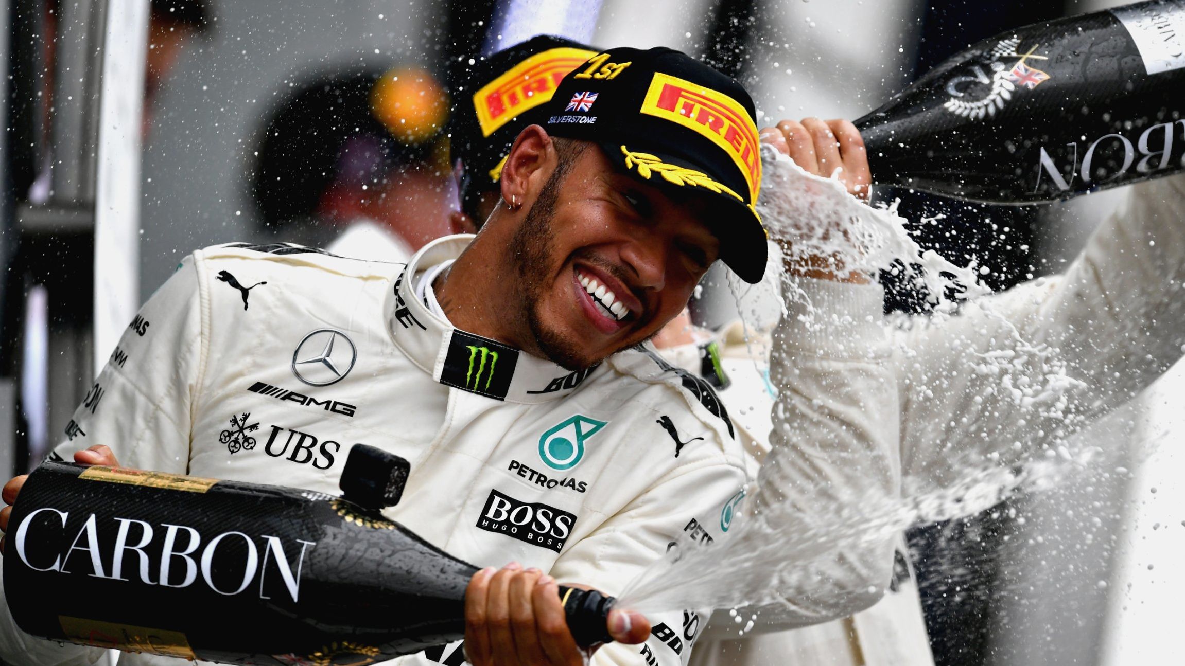 Lewis Hamilton celebrates in traditional style after winning his fourth race of the 2017 season.