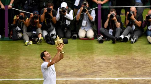 Roger Federer of Switzerland celebrates his eighth singles title at Wimbledon on July 16, 2017. Federer beat Croatia's Marin Cilic, 6-3, 6-1, 6-4.