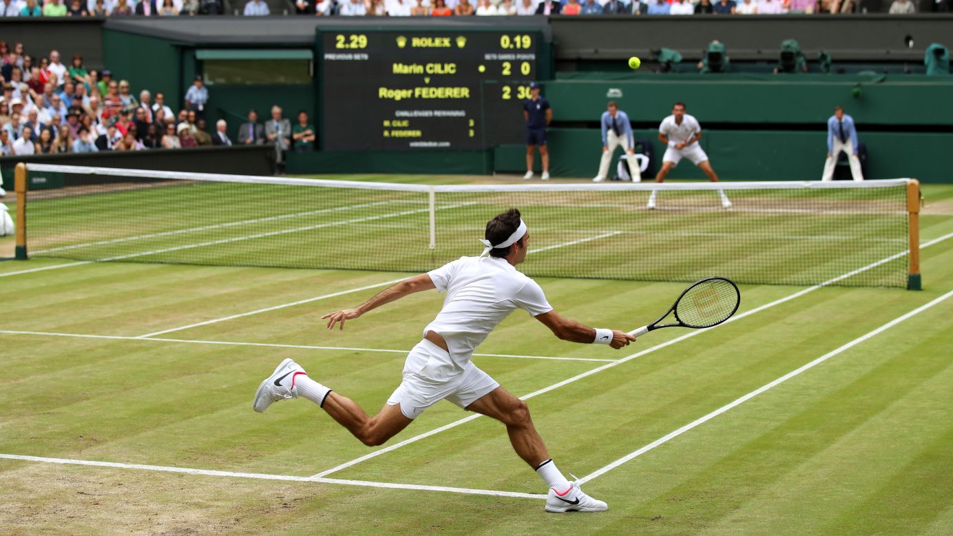 Federer hits a return.