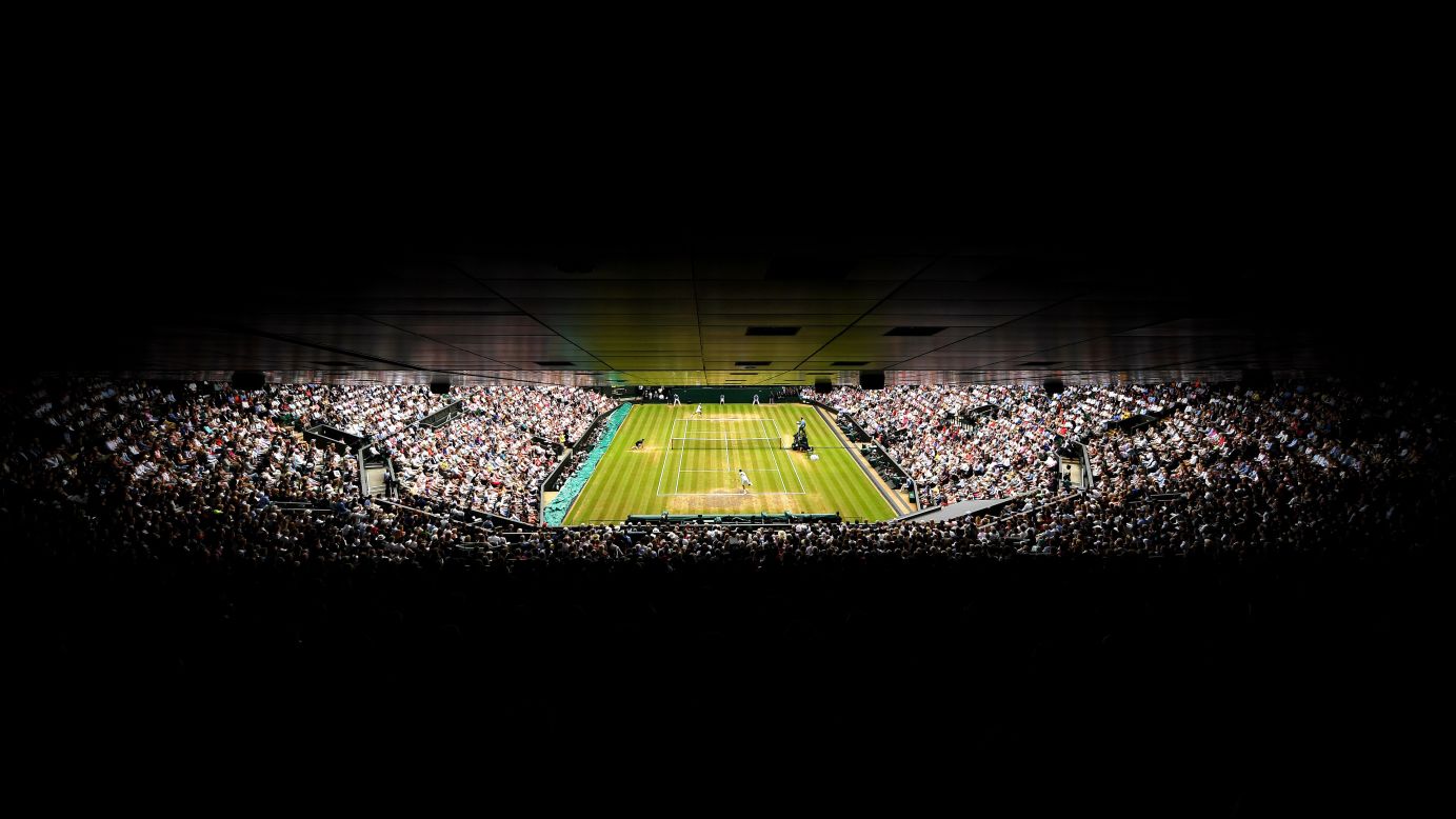 Federer and Cilic entertain a packed Centre Court during the men's final on day 13 of  Wimbledon.