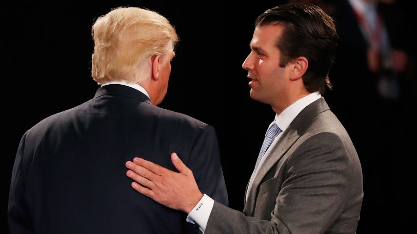 Donald Trump, Jr. (R) greets his father Republican presidential nominee Donald Trump during the town hall debate at Washington University on October 9, 2016 in St Louis, Missouri. This is the second of three presidential debates scheduled prior to the November 8th election.