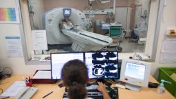 A nurse monitors a patient during a scan at the Argenteuil hospital in the suburbs of Paris on July 22, 2013. AFP PHOTO / FRED DUFOUR        (Photo credit should read FRED DUFOUR/AFP/Getty Images)