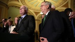 Sen. John McCain (L) (R-AZ) speaks with members of the Republican leadership, including Senate Majority Leader Mitch McConnell (R) about the Defense Authorization Bill following caucus luncheons at the U.S. Capitol June 9, 2015 in Washington, DC. The Senate is expected to begin voting on the Defense Authorization bill later this afternoon. 