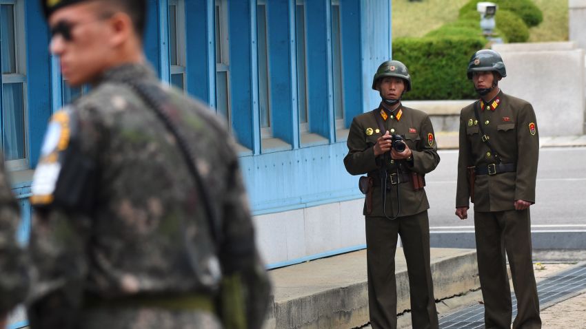 North Korean soldiers (R) look at the South side while US Vice President Mike Pence (not pictured) visits the truce village of Panmunjom in the Demilitarized Zone (DMZ) on the border between North and South Korea on April 17, 2017.
Pence arrived at the gateway to the Demilitarised Zone dividing the two Koreas, in a show of US resolve a day after North Korea failed in its attempt to test another missile. / AFP PHOTO / JUNG Yeon-Je        (Photo credit should read JUNG YEON-JE/AFP/Getty Images)